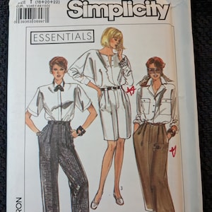 May include: Simplicity sewing pattern number 9166, Essentials, for sizes Y (18, 20, 22) or EUR Y (46, 48, 50). The pattern includes three different styles of clothing: a white blouse with a button-up front, a white tunic with a button-up front and a brown skirt with a high waist.