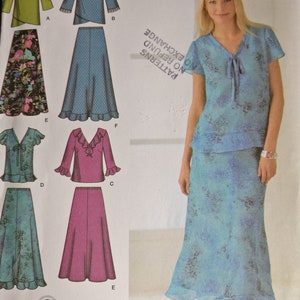 May include: A sewing pattern for a two-piece outfit featuring a skirt and a blouse. The pattern offers various styles for the blouse, including a long-sleeved blouse with a frill, a short-sleeved blouse with a frill, and a short-sleeved blouse with a tie. The skirt is a long, flowing skirt with a frill at the hem. The pattern is for sizes 20W-28W. The pattern is from Simplicity and is easy to sew.
