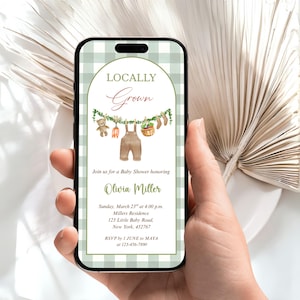 May include: A smartphone displays a baby shower invitation with a green gingham border. The invitation reads "Locally Grown" above illustrations of baby clothes and vegetables. Details include the date, time, location, and RSVP information.
