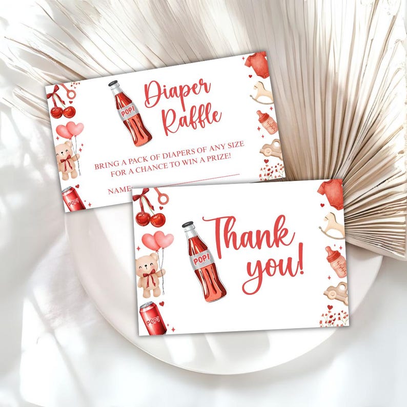 May include: Two white baby shower cards with red accents. One card reads "Diaper Raffle" and the other says "Thank you!". Both cards feature illustrations of a soda bottle, teddy bear, and baby-themed icons.