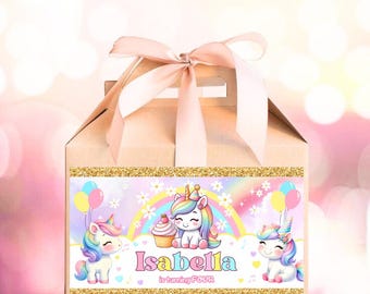 May include: A light brown gift box with a pink ribbon and a decorative label. The label features cartoon unicorns, a rainbow, and the name "Isabella" with the text "is turning FOUR". The label has a gold glitter border.