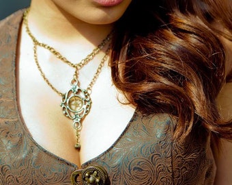 Steampunk... Gothic... Victorian...Multi-chain necklace with Filigree setting and a free-swinging clock gear