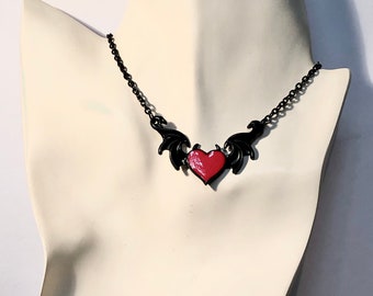 Bat wing choker necklace in black with devilish red heart