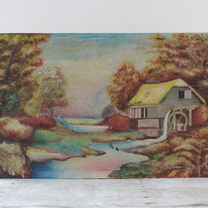 May include: Oil painting of a rural landscape featuring a watermill. The artwork depicts a small wooden building with a yellow roof, a water wheel, and a stream. The surrounding area includes trees with autumn foliage and a cloudy sky.
