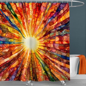 May include: A colorful abstract shower curtain with a stained glass design featuring a sunburst pattern in shades of red, orange, yellow, blue, and purple.