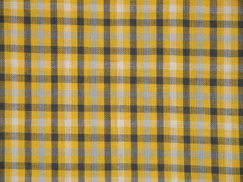 May include: A yellow and black checkered fabric with a subtle woven texture.