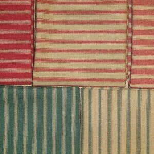 May include: Four fabric swatches with different patterns. The top two swatches are red and tan striped fabric. The bottom two swatches are green and tan striped fabric.
