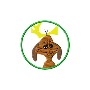 May include: Embroidered patch featuring a cartoon character with brown fur, large ears, and a yellow headpiece. The character is set within a green circular border, perfect for adding to clothing or accessories.