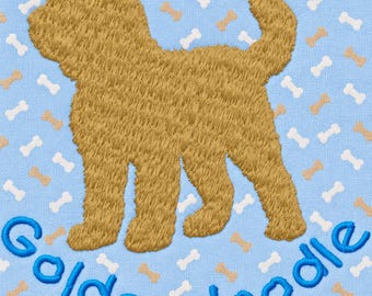 May include: A light blue fabric featuring an embroidered golden-brown dog silhouette and a repeating pattern of small white and tan bone shapes. The word Goldendoodle is embroidered in a blue script font at the bottom of the fabric design.