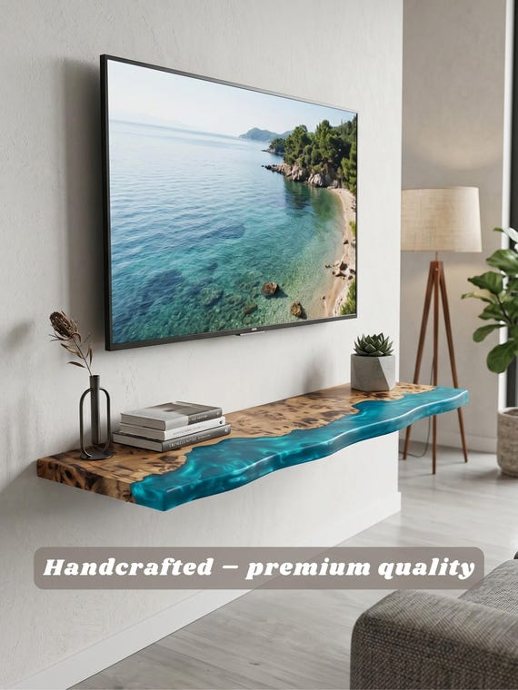 A 72-inch live-edge wood shelf with a flowing resin edge — custom-sized, wall-mounted, and the kind of statement furniture piece that anchors an entire room.