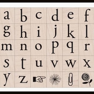 May include: A square grid of light wood tiles featuring black printed lowercase letters from a to z, followed by a pointing finger icon, a starburst, a paperclip, and a spiral flower design, all arranged in a structured, uniform layout.