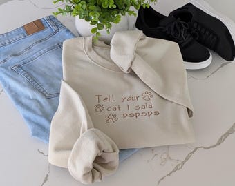 Tell Your Cat I Said Pspsps Sweatshirt | Funny Cat Lover Crewneck | Minimalist Neutral Embroidered Sweater | Cozy Gamer Cat Mom Gift