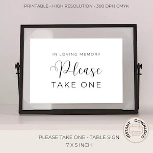 May include: Printable sign in a black frame that reads "In loving memory, Please take one". The sign is 7 inches by 5 inches and is a table sign.