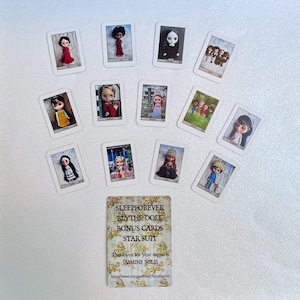 May include: A collection of Blythe doll bonus cards featuring various doll portraits in different outfits. The cards are rectangular with white borders and are scattered on a white surface. One card has text that reads "SLEEPFOREVER BLYTHE DOLL BONUS CARDS STAR SUIT".