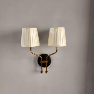 Illuminate in Style: Vintage-Inspired Double Arm Wall Sconce
