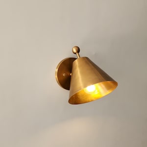 Handmade Vintage Style Wall Lighting Featuring Two Solid Brass Sconces with Decorative Finials, Shown Together in A Balanced Arrangement. the Classic Fixtures Have 5 Inch Round Canopies and Carefully Finished Brass Surfaces, Giving the Pair a Refined Architectural Presence, Frost Lights.