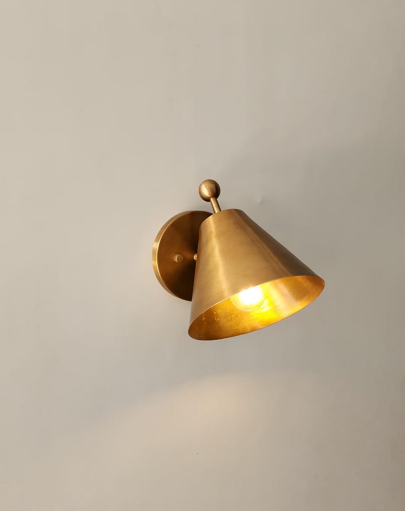 Handmade Vintage Style Wall Lighting Featuring Two Solid Brass Sconces with Decorative Finials, Shown Together in A Balanced Arrangement. the Classic Fixtures Have 5 Inch Round Canopies and Carefully Finished Brass Surfaces, Giving the Pair a Refined Architectural Presence, Frost Lights.