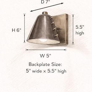 The Tapered Wine Shade Is the Focal Point of This Handcrafted Wall Sconce, Complemented by Solid Brass Detailing and Rivet Accents that Give the Compact Fixture a Refined Vintage Modern Character, Frost Lights.