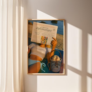 Barbiecore Beach Print – Retro Aesthetic Summer Wall Art, Fashion Doll Reading Newspaper on Beach Blanket, Dollhouse Decor for Coastal Vibes