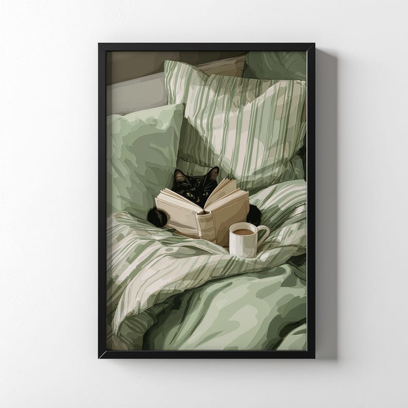 May include: A framed print depicts a black cat reading a book in bed. The cat is nestled among green and white striped bedding and pillows. A white mug of coffee sits nearby. The artwork has a cozy, relaxing theme.