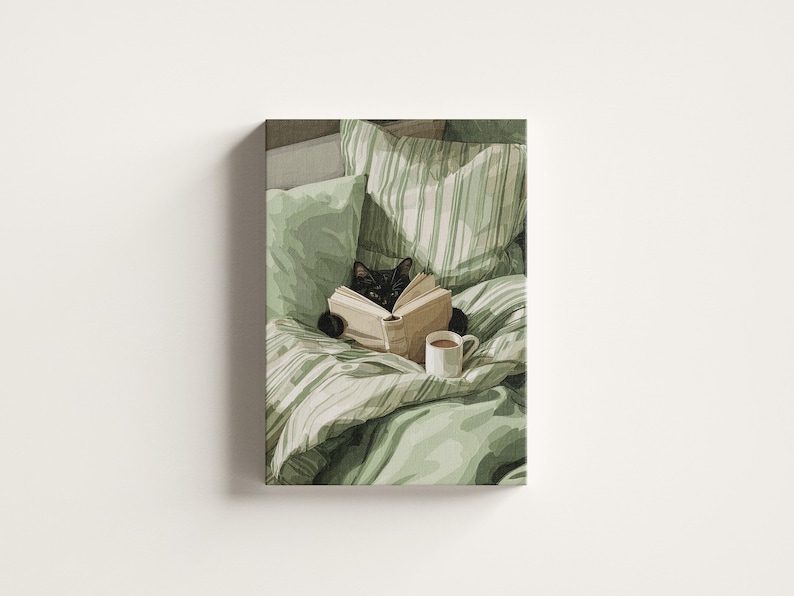 May include: A canvas print depicts a black cat reading a book in bed. The cat is surrounded by green and white striped pillows and a green comforter. A white mug of coffee sits nearby. The artwork has a cozy, relaxing theme.