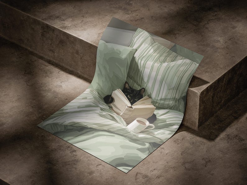 May include: A black cat is nestled among pillows and a blanket, engrossed in a book. A white mug with a dark beverage sits nearby. The bedding features a soft green color with striped and solid patterns, creating a cozy scene.