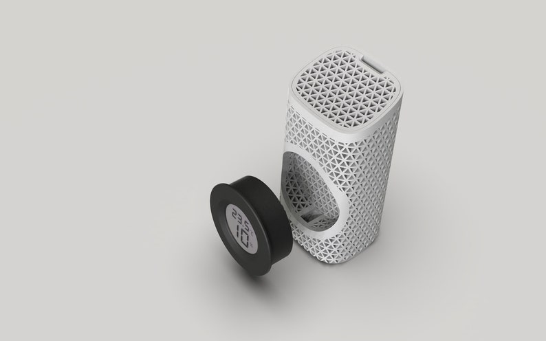 May include: A white cylindrical air purifier with a geometric pattern and a black round base with a digital display showing the temperature 23.2 degrees.