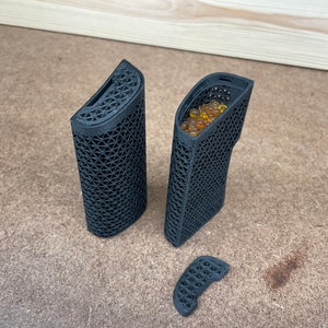 May include: Three black 3D printed containers, one with a removable lid and one filled with small yellow beads.