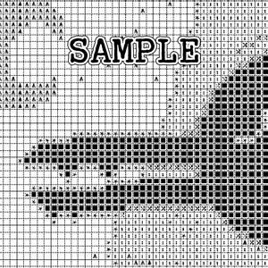 May include: Black and white cross stitch pattern with the word "SAMPLE" in bold letters at the top. The pattern features a design of a bird with its wings spread.