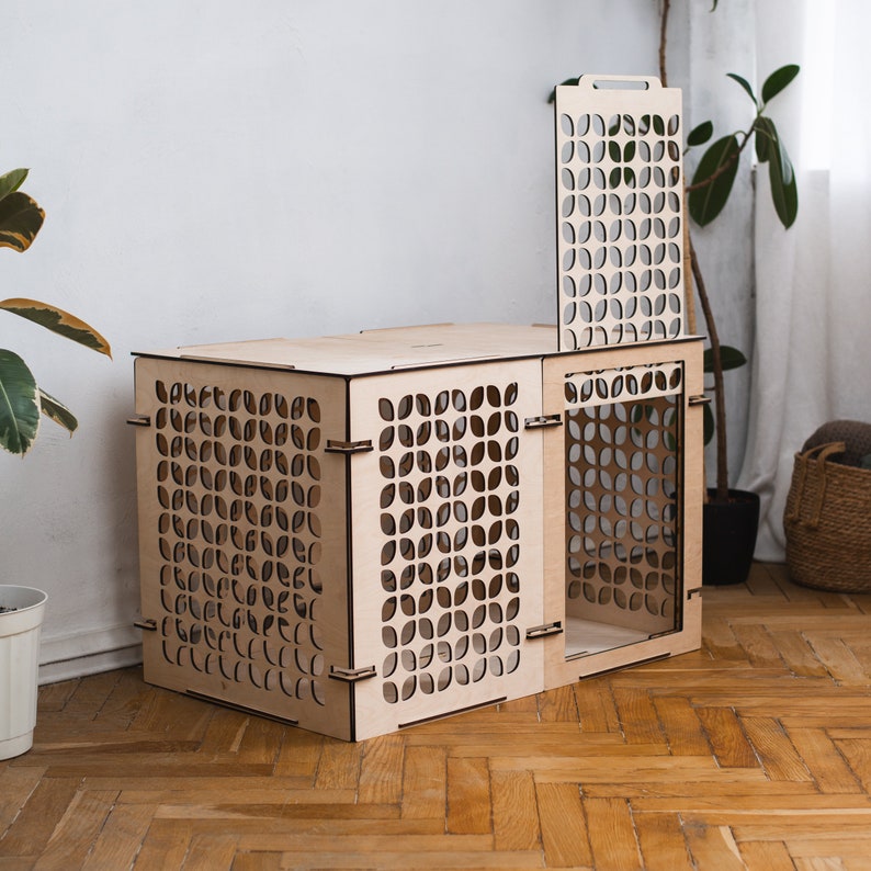 May include: A wooden cat house with a geometric pattern. The house is made of plywood and has a removable front panel. The house is light brown in color and has a modern design.