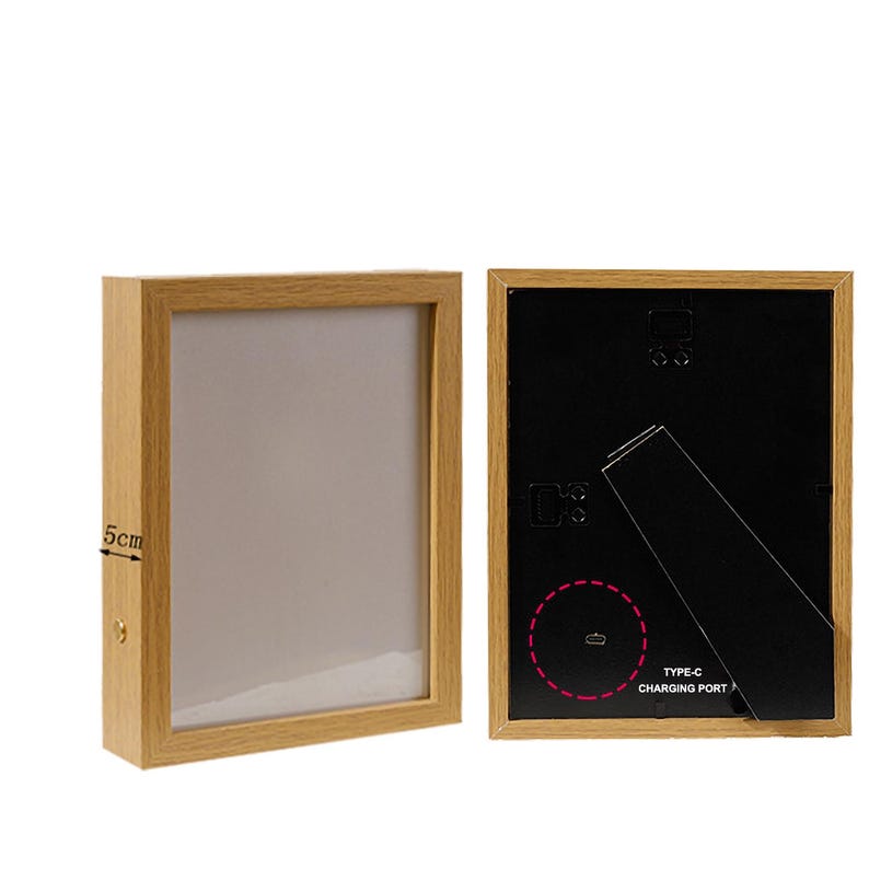 May include: Two wooden picture frames, one with a white background and the other with a black background. The black frame has a type-c charging port on the back.
