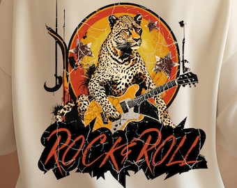 May include: White sweatshirt with a graphic print of a leopard playing a guitar with the words "Rock & Roll" in a distressed font.