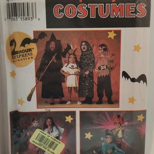 May include: A Simplicity Costumes sewing pattern for children's Halloween costumes. The pattern includes five costumes: a witch, a Native American, a grim reaper, a pirate, and a genie. The pattern is for sizes small, medium, and large.