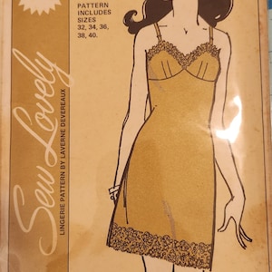 May include: A vintage sewing pattern for a full slip, featuring a line drawing of a woman wearing the garment. The pattern is for sizes 32, 34, 36, 38, and 40. The pattern is titled "Ladies' Full Slip" and is priced at $1.00.