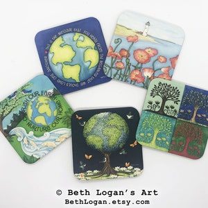 May include: Set of four square coasters featuring nature-inspired designs. One coaster shows a green globe with the text "Cherish Our Earth. Nurture Our Home." Another coaster shows a green tree with a blue background and butterflies. A third coaster shows a lighthouse on a beach with red poppies. The final coaster shows four trees in different seasons, each with a different color background.