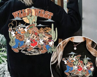 May include: Black sweatshirt with a graphic print of Mickey Mouse, Minnie Mouse, and Goofy dressed as cowboys in a desert landscape. The text "WILD WEST" is printed above the characters.