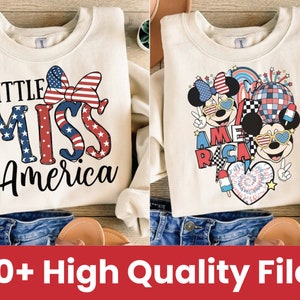 May include: Two cream-colored sweatshirts with red, white, and blue designs. One sweatshirt features the text "Little Miss America" with a red, white, and blue bow. The other sweatshirt features two cartoon characters with red, white, and blue accents and the text "America" with a red, white, and blue checkered pattern.