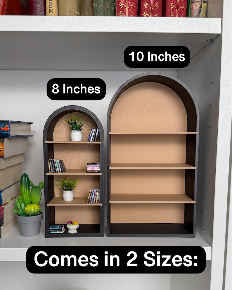 May include: Two black arched shelves with brown shelves. The smaller shelf is 8 inches wide and the larger shelf is 10 inches wide. The text "Comes in 2 Sizes" is at the bottom of the image.