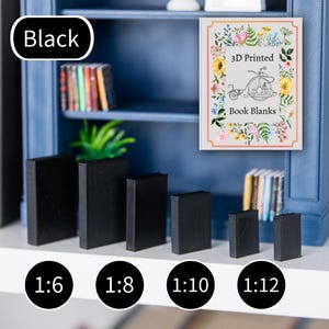 May include: A collection of black 3D-printed book blanks in various sizes, labeled 1:6, 1:8, 1:10, and 1:12. The text "Black" is displayed above the books. A sign reads "3D Printed Book Blanks" with a floral border.