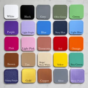 May include: A color palette featuring 25 square acrylic swatches in various colors. Colors include white, black, grey, olive green, green, purple, light purple, blue, navy blue, light blue, pink, light pink, terracotta, red, orange, brown, tan, beige/bone white, yellow, sea green, galaxy purple, gold, copper, silver, and shiny purple.