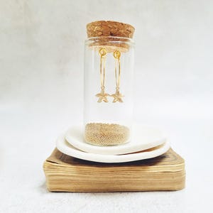 Gold Starfish Hoop Earrings in a bottle