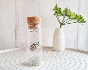 ボトルに入ったアンモナイトのイヤリング