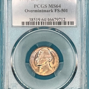 May include: A 1955-D/S  nickel coin graded MS64 by PCGS with an overmintmark FS-501. The coin is encased in a clear plastic holder with a black and white barcode label. The label also includes the coin's grade, year, and mint mark.