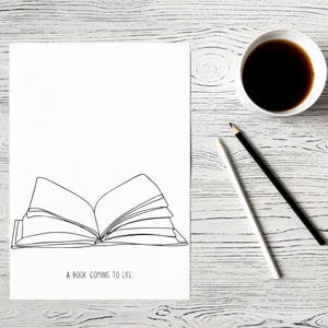 Op de afbeelding: Een zwart-witte lijntekening van een open boek met de tekst "A book coming to life." op een witte achtergrond.