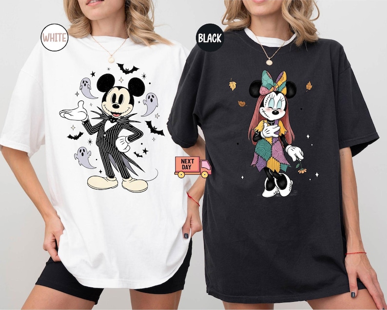 May include: White and black t-shirts featuring Disney characters in Halloween costumes. One shirt has Mickey Mouse dressed as Jack Skellington, surrounded by bats and ghosts. The other shirt has Minnie Mouse in a patchwork dress with autumn leaves.