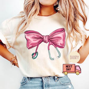 Comfort Colors® Coquette Nurse Stethoscope Bow Shirt,Gift for Nurse,Bow Oversized Shirt,Nurse Appreciation,Christmas Gift for Nurse,Pink Bow