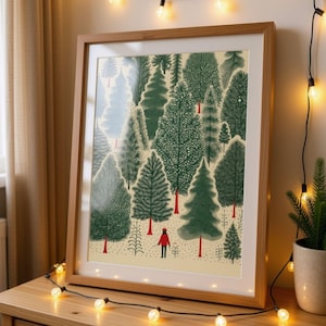 May include: A framed art print featuring a forest scene with various green evergreen trees and a small figure wearing a red coat and hat standing in the center. The illustration uses a cream-colored background and includes red tree trunks.