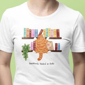 Cat Lover&#39;s Bookish Shirt - Cute Kitty Reading Book for Book and Cat Enthusiasts, Pawsitively Hooked on Books