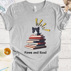Cat Lover&#39;s Bookish Shirt - Cute Kitty Reading Book for Book and Cat Enthusiasts, Paws and Read