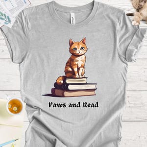 Cat Lover&#39;s Bookish Shirt - Cute Kitty Reading Book for Book and Cat Enthusiasts, Paws and Read